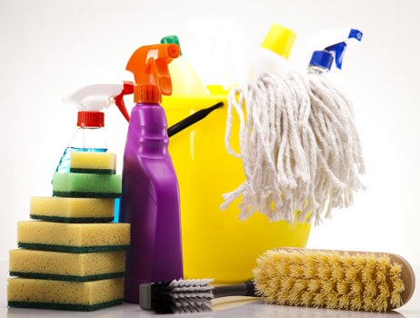 Carpet cleaning equipment being used with care in a room
